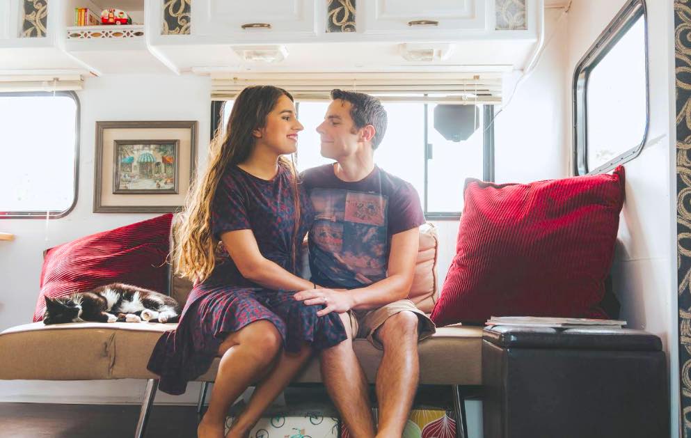 Milk and Honey Magazine interviews tiny house young married couple in their 20's traveling the world! They love Jesus, love their marriage, and especially - love their tiny home!